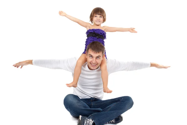 Handsome father with his little daughter on his shoulders happil — Stock Photo, Image