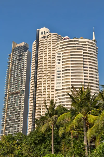 Skyscrapers in the palms — Stock Photo, Image