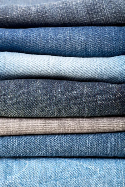 Stack of blue jeans background — Stock Photo, Image