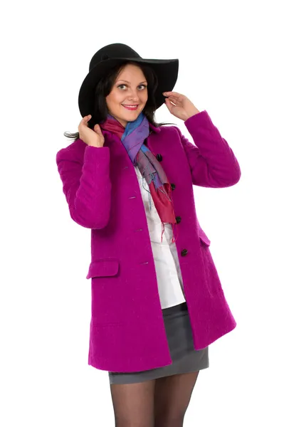 Veselá dívka v kabátě a klobouku — Stock fotografie