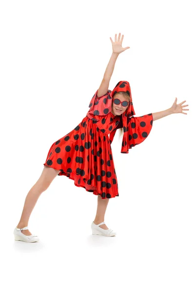 Menina adolescente dançando em um vestido vermelho polka-dot — Fotografia de Stock