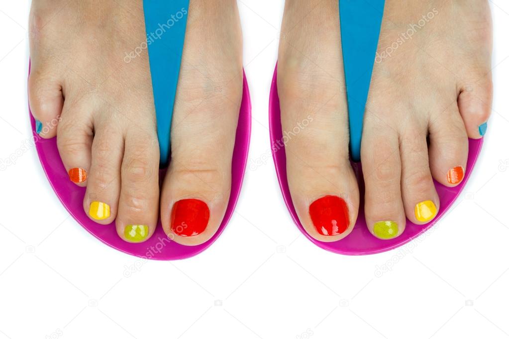 Beautiful female feet with a pedicure color