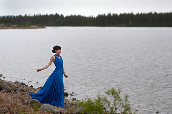 Girl in a blue dress — Stock Photo, Image