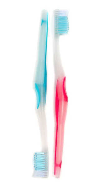 A blue and a red toothbrush isolated on white background. — Stock Photo, Image