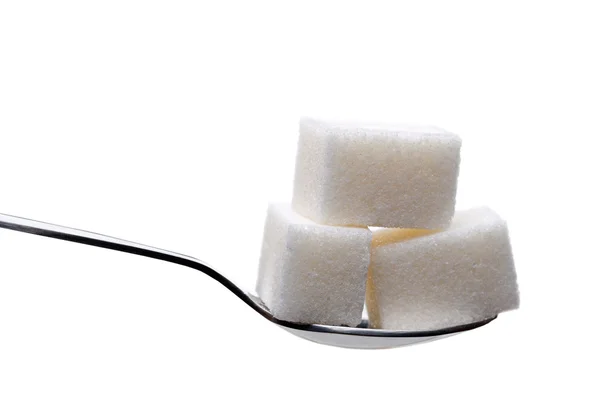 Spoon with sugar cubes isolated — Stock Photo, Image