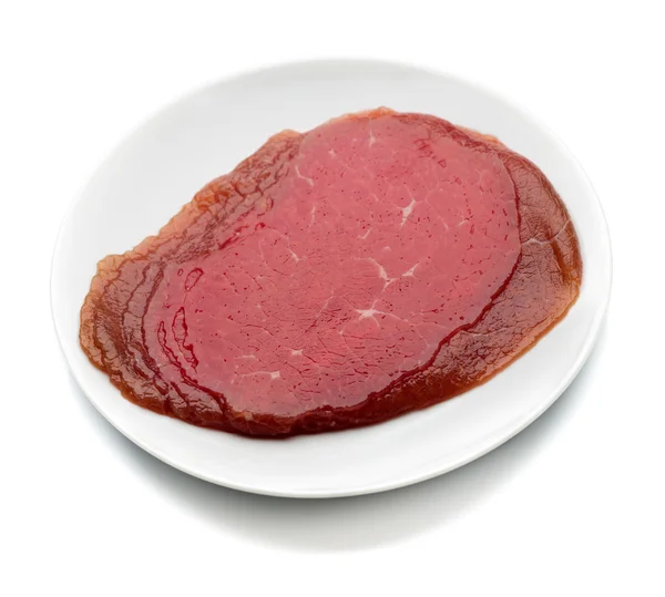 Carne affumicata su un piatto — Foto Stock