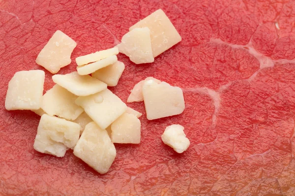 Cheese on a background of meat — Stock Photo, Image