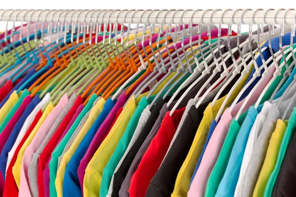 Colored shirts on hangers steel closeup. — Stock Photo, Image
