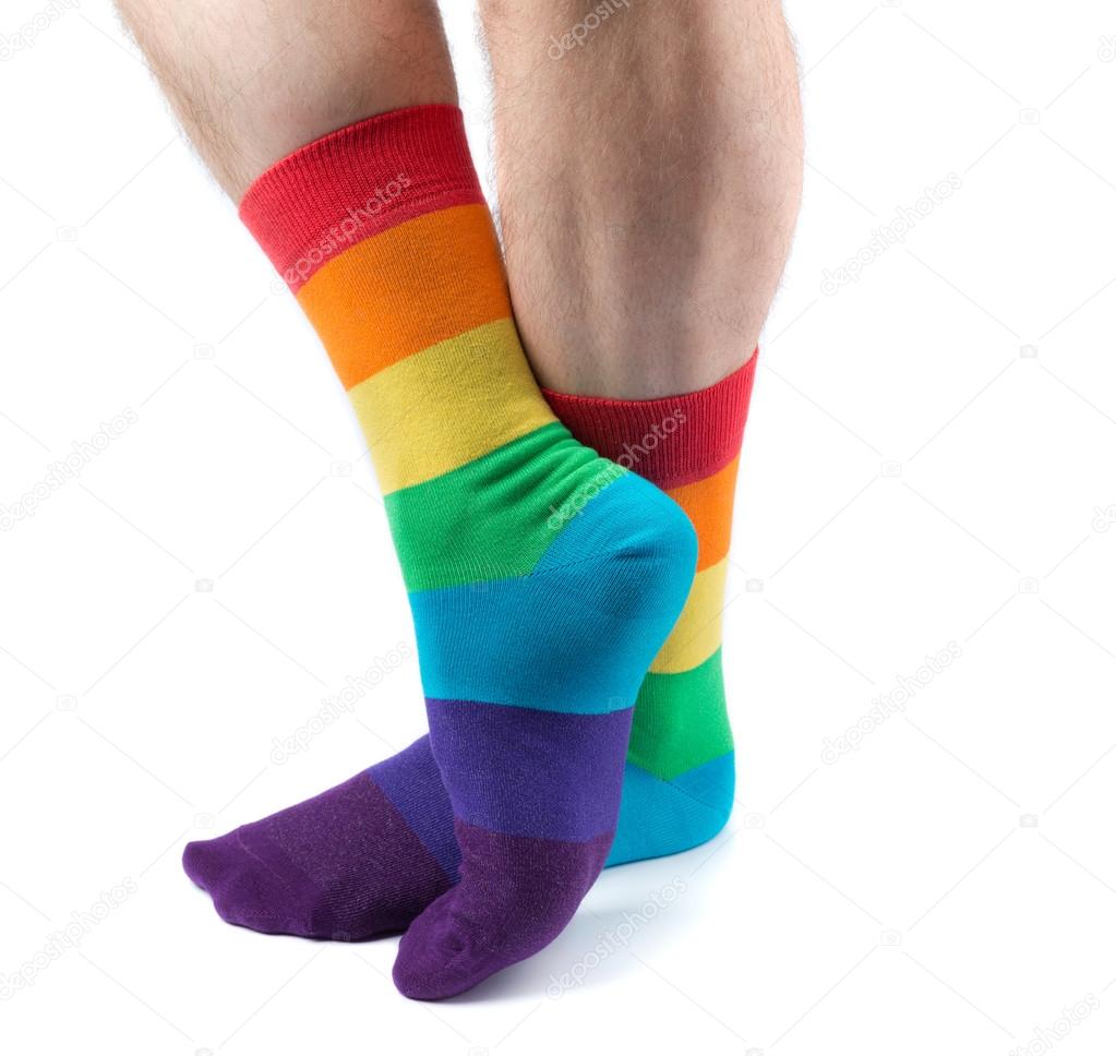 Men's hairy legs in colored striped socks fun