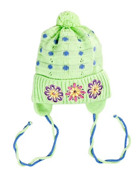 Green baby knitted hat with a flower pattern — Stock Photo, Image