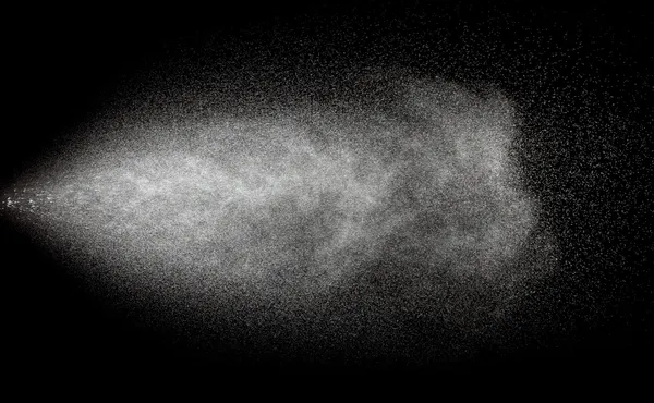 Spraying of water in motion on black background — Stock Photo, Image