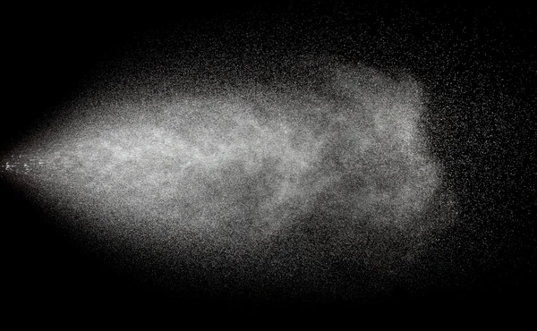 Pulverización de agua en movimiento sobre fondo negro Imagen de archivo