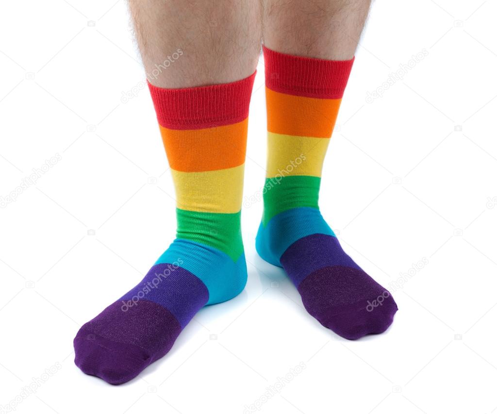 Mens hairy legs in colored striped socks fun. Isolate