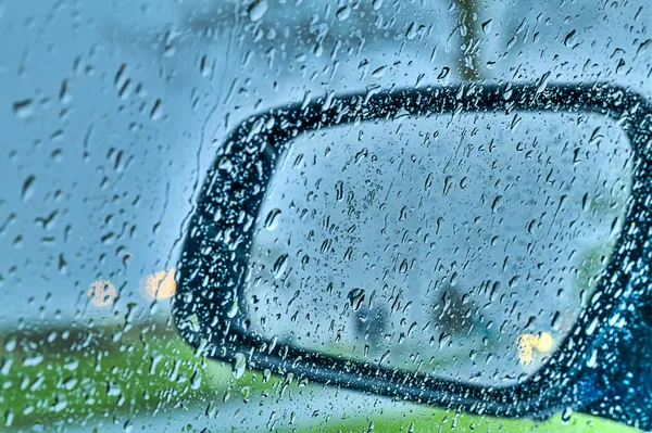 Droplets and car lights reflections through rear view mirror, hd — Stock Photo, Image