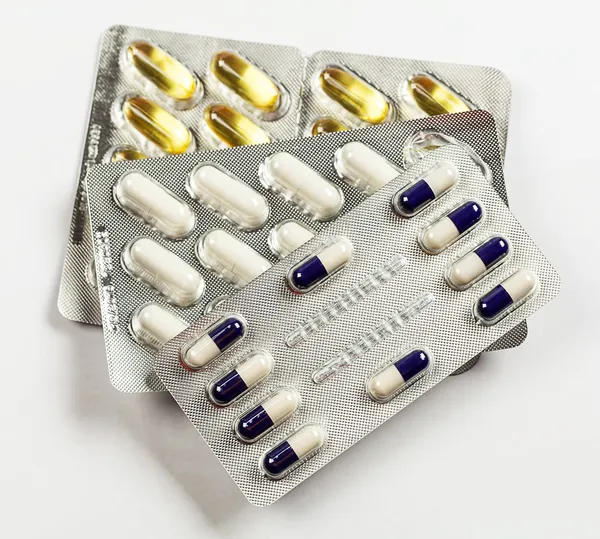 Capsules and pills packed — Stock Photo, Image