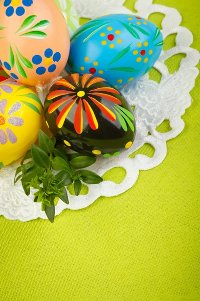 Beautiful decorative easter eggs in a basket — Stock Photo, Image