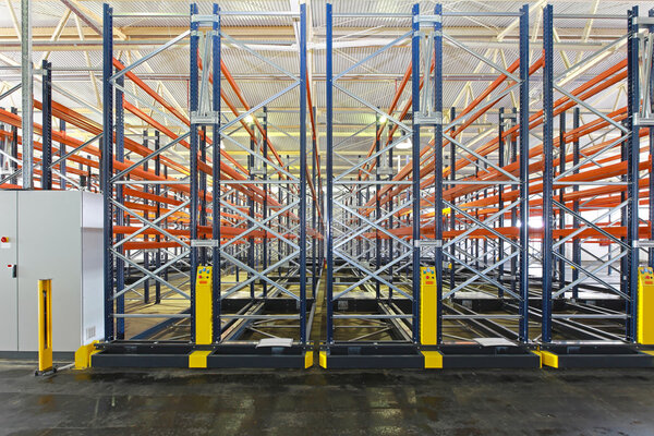 Mobile aisle roller racking system in warehouse
