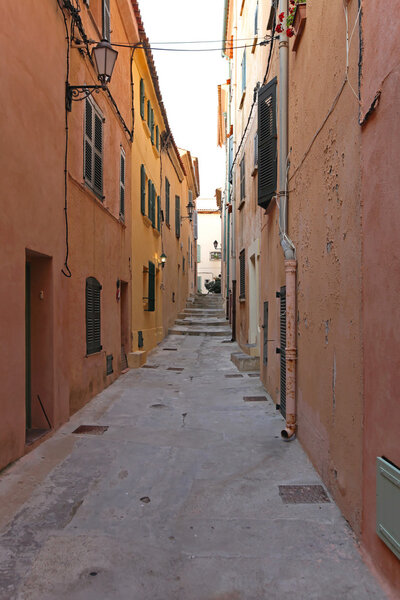Narrow street and traditional houses in Saint Tropez