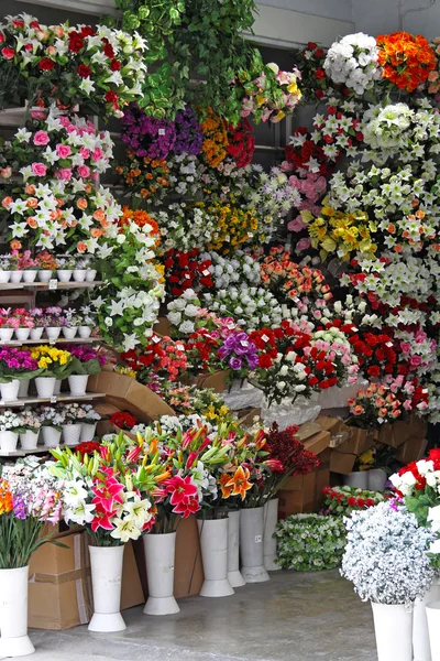 Plastic flower shop Stock Photo