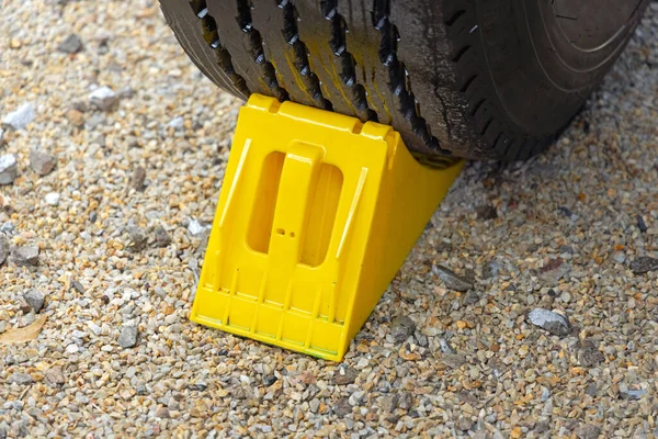 Yellow Plastic Wheel Chock Parking Trailer Safety — Stock Photo, Image