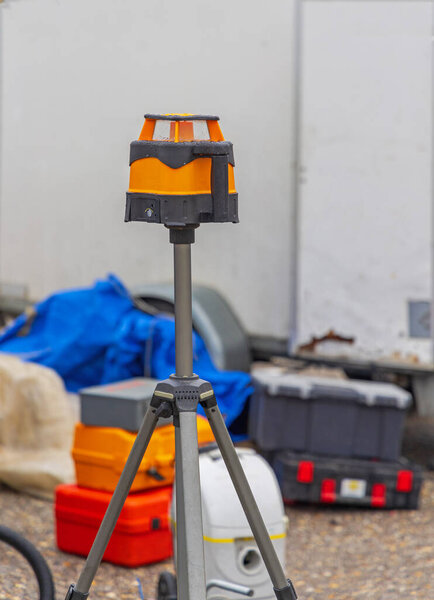 Laser Level Measuring Device at Tripod Construction Site