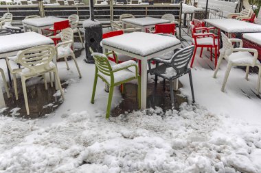 Outdoor Coffee Shop Terrace Covered With Wet Snow Winter Weather