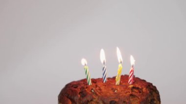Blow Out Four Candles at Birthday Party Cake