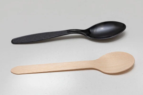 Two Spoons Wooden Plastic Environment Choice — Stock Photo, Image