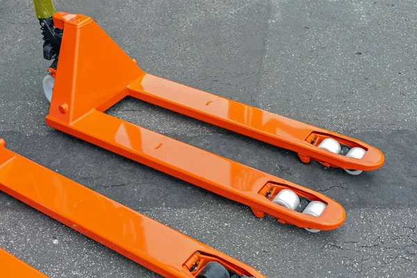 Long Orange Forks Wheels Pallet Jack — Stock Photo, Image
