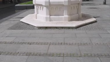 White Marble Stone Fountain With Little Red Rooster at Top