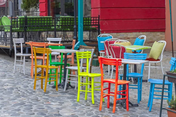 Colourful Wooden Chairs Cobblestones Street Cafe — 图库照片