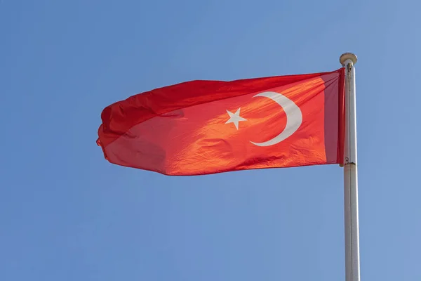 New Bright Red Flag of Turkey at Clear Blue Sky