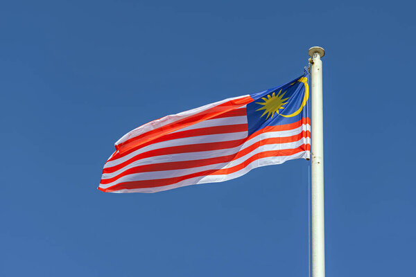 Malaysia National Flag Stripes of Glory at Sunny Day Blue Sky