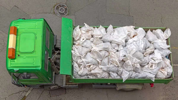 Tipper Truck Filled With White Sacks Bags Top View