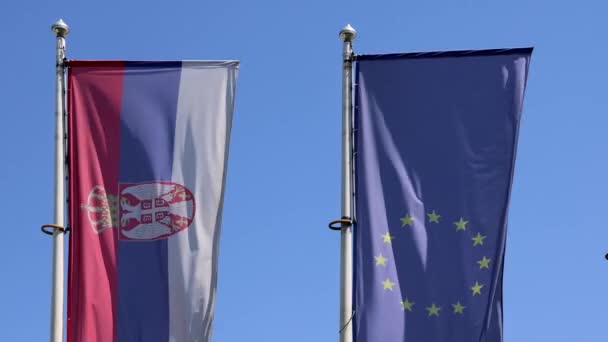 Serbian European Union Flags Together Windy Sunny Day — Αρχείο Βίντεο