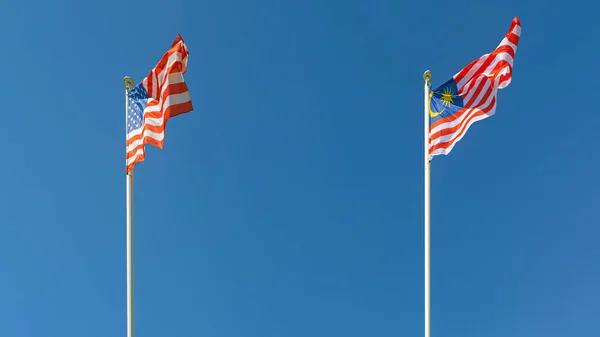 United States America Malaysia Flags Together Sunny Day Blue Sky — Stockfoto
