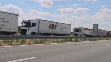 Horgos Roszke, Hungary - August 01, 2022: Long Queue of Lorry Cargo Trucks Stuck at EU Border Entrance.
