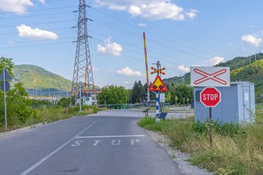 Single Tracks Railroad Crossing Stop Sign and Warning Lights