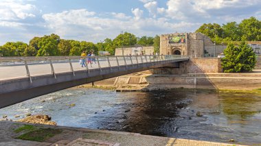Nis, Serbia - August 04, 2022: Pedestrian Bridge Over Low Tide River Nisava at Hot Summer Day.