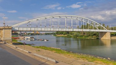 Downtown Bridge Belvarosi Over Tisza River at Hot Sunny Summer Day