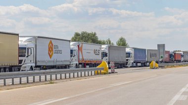 Horgos Roszke, Hungary - August 01, 2022: Long Queue of Lorry Cargo Trucks Stuck at EU Border Entrance.