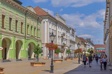Subotica, Serbia - August 01, 2022: People Walking at Promenade Korzo Street Hot Sunny Summer Day.