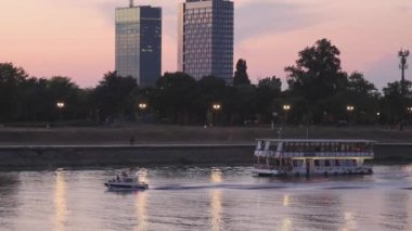 Belgrade, Serbia - August 16, 2022: Tourist Cruise Boat at Sava River Summer Evening in Capital City.
