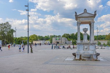 Nis, Serbia - August 04, 2022: Drinking Water Roman Fountain Cair at King Milan Square in City Centre Hot Summer Day.