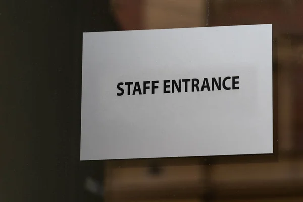 Staff Entrance Sign Info at Glass Door