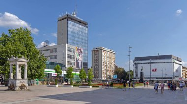 Nis, Serbia - August 04, 2022: People Walking at King Milan Square in City Centre Hot Summer Day. clipart