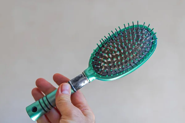 Green Plastic Hair Brush Holding Man Hand — Stock Photo, Image