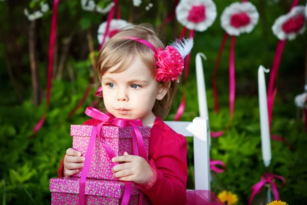 Little girl with birthday presents — Stock Photo, Image