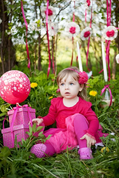 Little girl with birthday presents — Stock Photo, Image