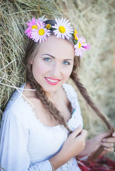 Girl with flower wreath outdoors — Stock Photo, Image